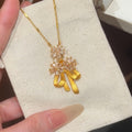 Gold Tone Crystal Flower Necklace With Amber Color Drop Charms view 1
