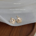 White Camellia Flower Stud Earrings Gold Rim Clear Center view 3