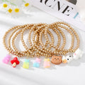 Gold Tone Beaded Gummy Bear Mushroom Cat and Cow Charm Bracelets view 1