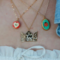 Apple Slice And Ladybug Pendant Necklaces In Gold Tone Metal view 2