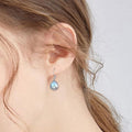 Silver Tone Lotus Teardrop Moonstone-Look Leverback Earrings view 3