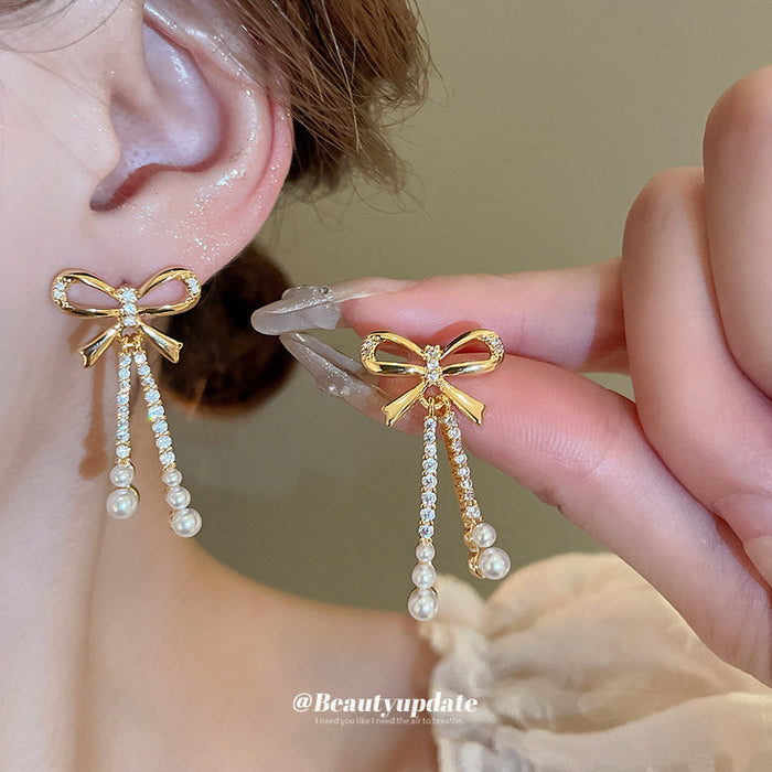 Gold Tone Bow Stud Earrings With Pearl Chain Tassels