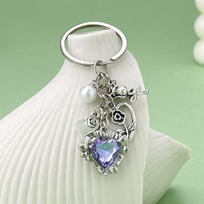Image 1 showing a key chain with an heart shaped charm.