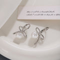 Gold Tone Bow White Pearl Look Ball Huggie Earrings view 4