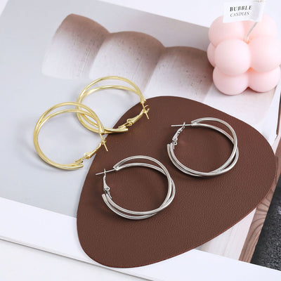 Primary supplied view of double crossover hoop earrings