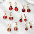 Gold Tone Red Ladybug Huggie Earrings in Six Designs view 1