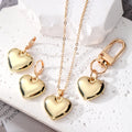 Gold Tone Puffy Heart Necklace Earrings and Clip Keychain view 1