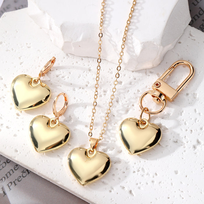 Gold Tone Puffy Heart Necklace Earrings and Clip Keychain