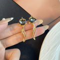 Black Faceted Top Gold Wavy Leaf Outline Dangle Earrings view 2