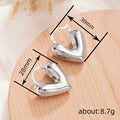 Gold and Silver Tone Heart Huggie Earrings Polished Jewelry Accessory view 4