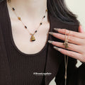 Gold Tone Brown Beaded Striped Gourd Pendant Necklace view 1