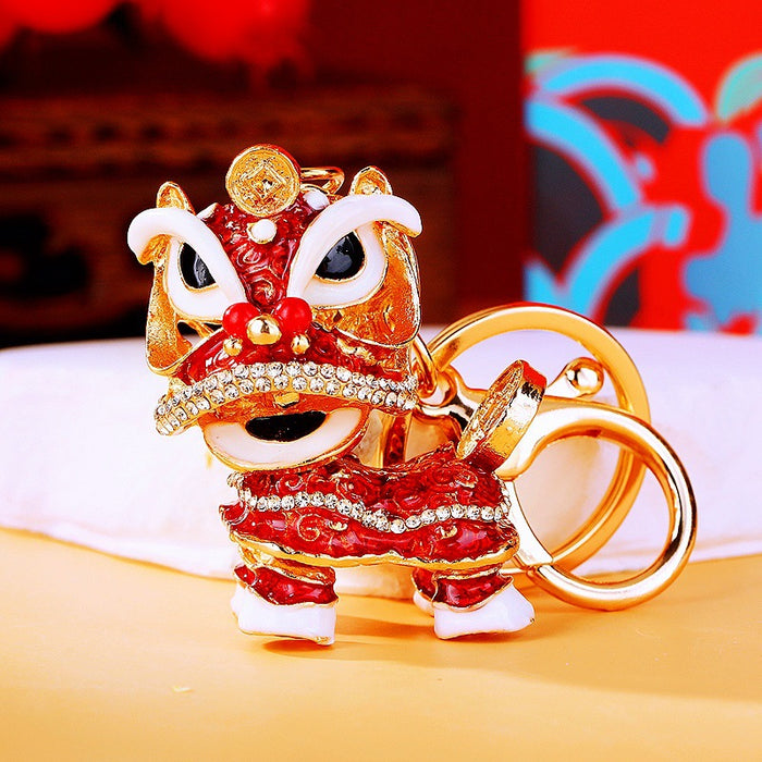 Gold Tone Lion Dance Keychains with Crystals and Braided Straps