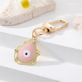 Gold Tone Filigree Oval Teardrop and Star Evil Eye Clip Keychains view 2