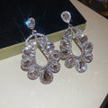 Silver Crystal Teardrop Cluster Stud Earrings with Polished Metal Details view 7