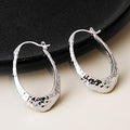 Hammered Silver Tone Sculpted Oval Medium Hoop Earrings view 2