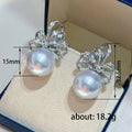 Silver Tone Clear Crystal Ribbon and Faux Pearl Stud Earrings view 4