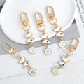 White Enamel Butterfly Evil Eye Letter Charm Gold Keychain view 3