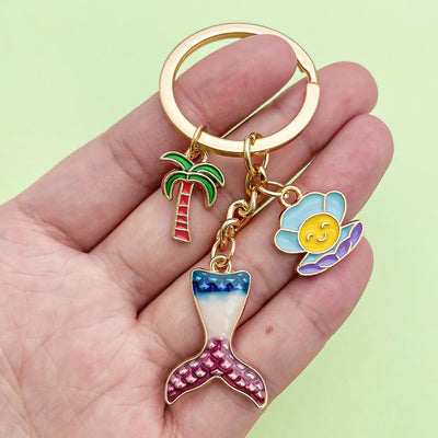 Image 1 showing starfish, shell and mermaid keychains shown in the product image.
