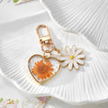 Gold Tone Daisy and Pressed Flower Heart Snap-Hook Keychains in Ten Options view 12