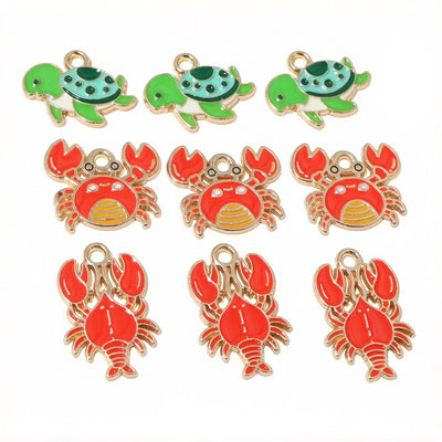 Assorted enamel turtle crab and lobster charms in bright colors arranged together in the main product view