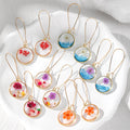 Gold Tone Round Pressed Flower and Glitter Resin Earrings view 1
