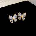 Gold Tone Bow Stud Earrings with Clear Stones and Pearl Centers view 6