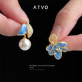 Gold Tone Blue Flower And White Pearl Asymmetric Stud Earrings view 1