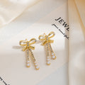Gold Bow Triple Chain Pearl Look Long Stud Earrings view 3