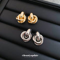 Interlocking Knot Stud Earrings in Gold Tone and Silver Tone view 1