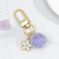 Wool Felt Ball Keychain With White Enamel Flower Charm And Gold-Tone Clasp view 2