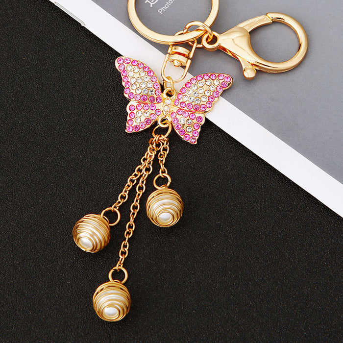 Pink Crystal Butterfly Tassel Keychain with Three Gold Tone Bead Drops