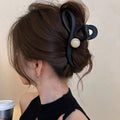 Gunmetal Tone Sculptural Loop Hair Claw With Large Round Bead Detail view 1