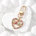 Gold Tone Rhinestone LOVE Heart Evil Eye Clip Keychains view 8