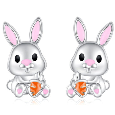 Front pair silver bunny orange carrot stud earrings on white