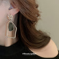 Gold Tone Black and White Asymmetric Geometric Earrings view 3