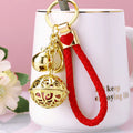 Hollow Palace Bell Keychains in Gold and Silver Tone Finishes view 1