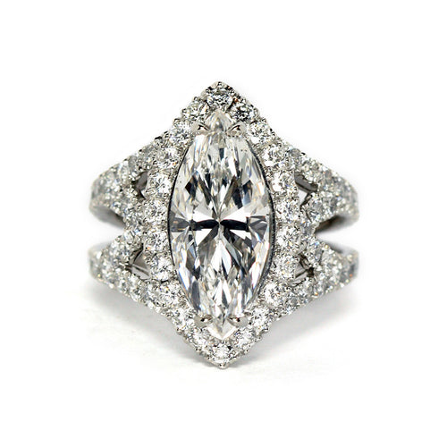 Front view of white metal marquise halo ring on white background