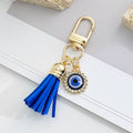 Gold-Tone Rhinestone Evil Eye Keychain with Blue Suede Tassel view 10