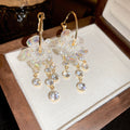 Clear Flower Crystal Hoop Drop Earrings in Gold Tone view 1