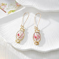 Gold Tone Candy-Shaped Pressed Flower Drop Earrings in Six Designs view 2