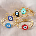 Gold Tone Round Glass Evil Eye Hinged Cuff Bracelets in Eight Colors view 3