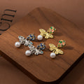 Gold and Silver Rose Butterfly Pearl Look Earrings view 2