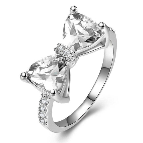 Clear double-triangle bow ring on white