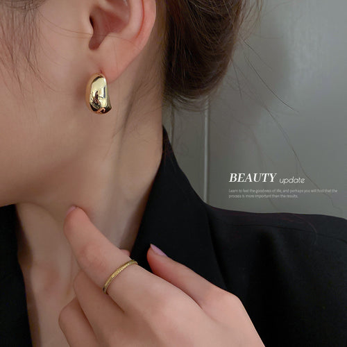 Three Style Gold and Silver Bean Shape Statement earrings in a on-ear view