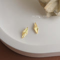 Gold Rhombus Diamond Stud Earrings Sunburst Cut Facets view 4