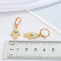 Gold Tone Hamsa Evil Eye Huggie Drop Earrings with Enamel Detail view 3