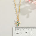 Gold Tone Crystal Hamsa Hand Pendant Necklace with Fine Chain view 3
