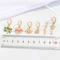 Gold Tone Huggie Earrings with Six Small Symbolic Drop Charms view 2