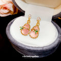 Gold Tone Pink Gourd Pearl Drop Earrings with Leaf Detail view 2