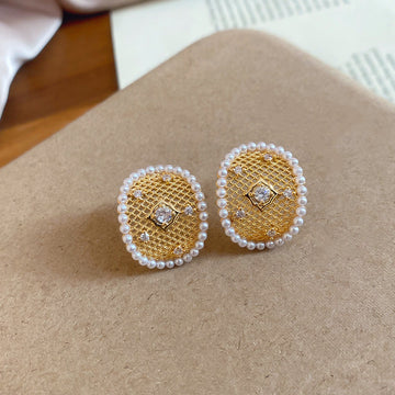 Pearl Center Open Round Stud Earrings in Gold and Silver Tones